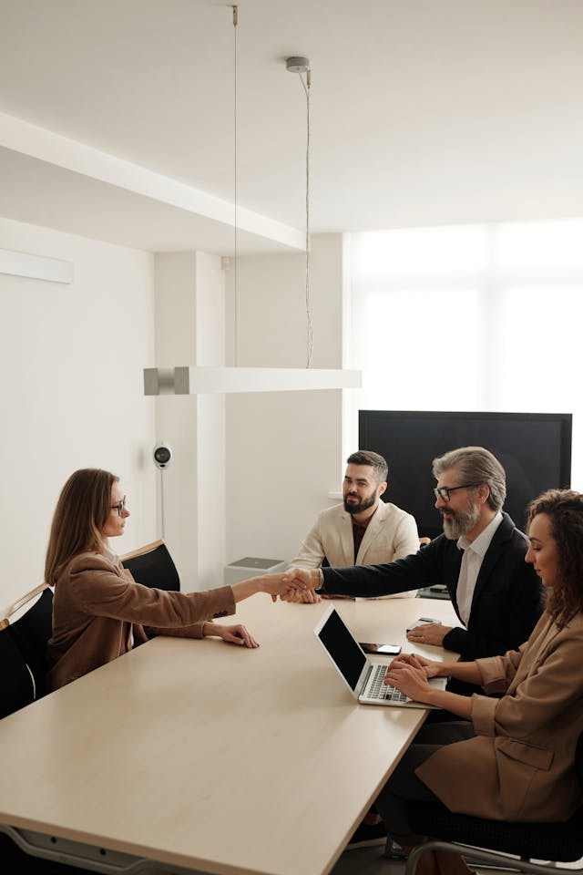 Business partners shaking hands, signifying a deal or agreement in business. This emphasizes the security provided by "Business Loan Protection Insurance Toronto."