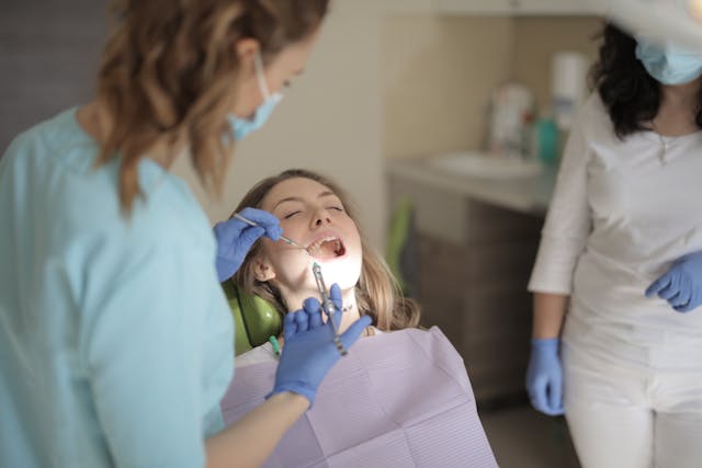 
Lady at a dentist in Toronto, receiving dental care covered by her extended health insurance, part of accident and sickness insurance in Toronto and surrounding areas.