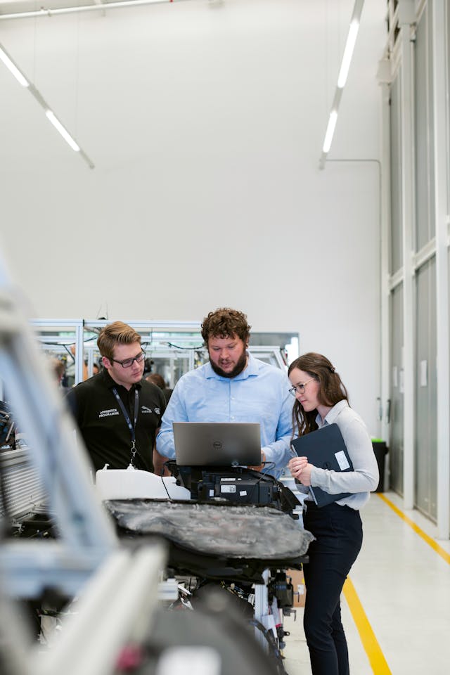 Three people working together, showcasing collaboration and support in a business environment. This reflects the necessity of "Key Person Disability Insurance Toronto."