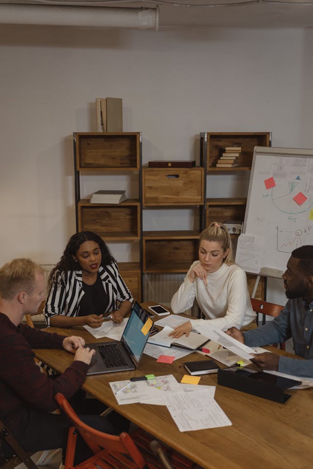 Team of workers collaborating in a conference room, emphasizing segregated funds, annuities, and retirement planning in Toronto and surrounding areas.