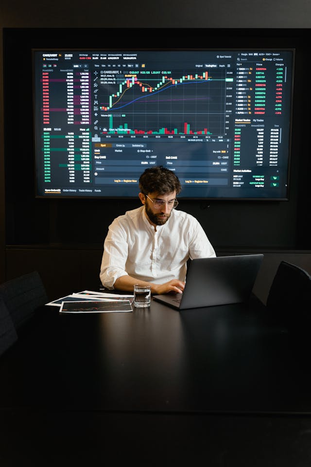 Man analyzing a segregated funds chart for retirement planning, focusing on segregated funds, annuities, and retirement planning in Toronto and surrounding areas