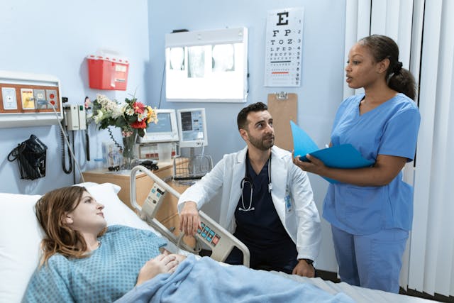 Accident and sickness insurance consultation in a Toronto, Ontario hospital with a doctor and nurse